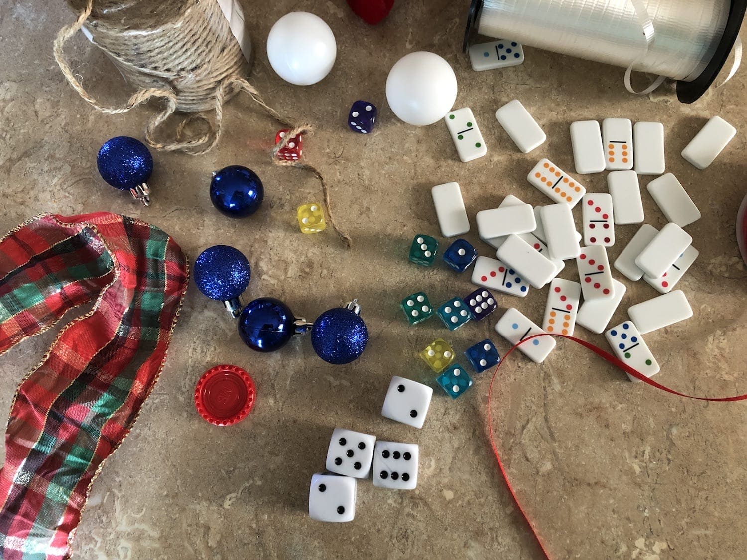 Love to play games? With a few simple craft supplies and a little imagination, you can create Christmas ornaments using game pieces.