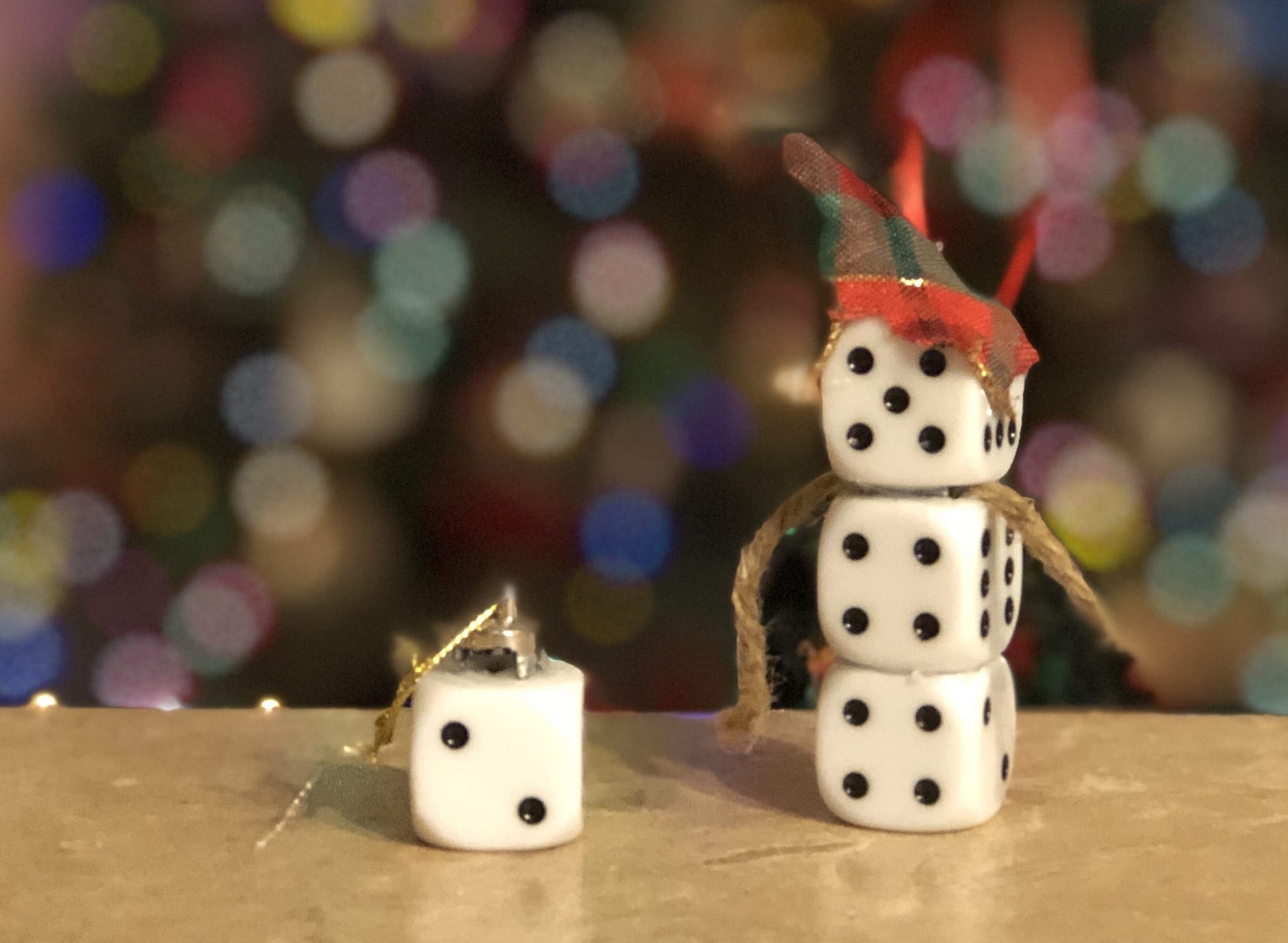 Love to play games? With a few simple craft supplies and a little imagination, you can create Christmas ornaments using game pieces.