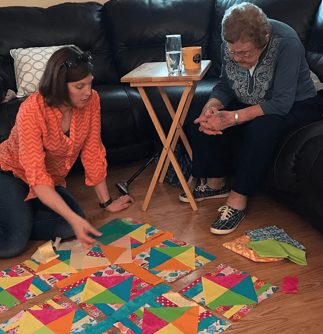 Sharon and Grandma working on quilt